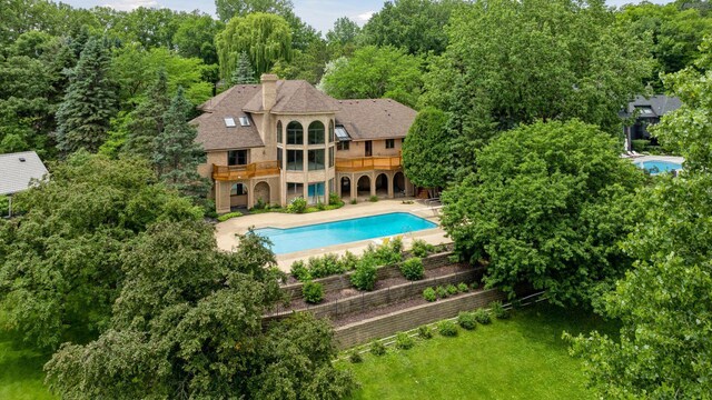 6541 Beach Rd, Eden Prairie, MN 55344 - view of pool featuring a patio area, a wooded view, and a wooden deck