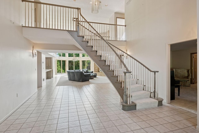 6541 Beach Rd, Eden Prairie, MN 55344 - stairs featuring a towering ceiling and tile patterned floors