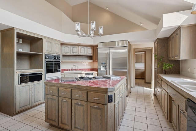 6541 Beach Rd, Eden Prairie, MN 55344 - kitchen featuring stainless steel appliances, open shelves, light tile patterned flooring, a warming drawer, and high vaulted ceiling