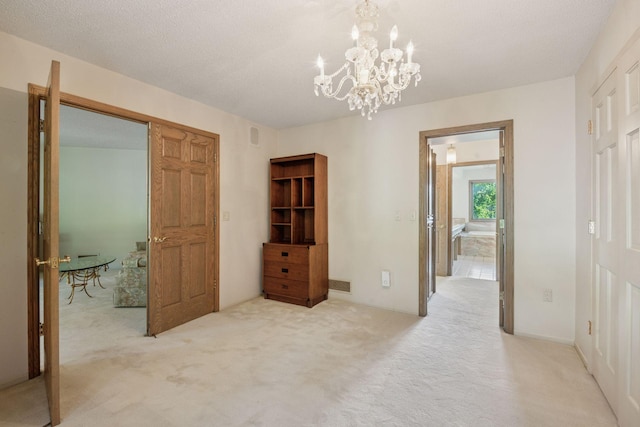6541 Beach Rd, Eden Prairie, MN 55344 - unfurnished bedroom with carpet flooring, a chandelier, and a closet