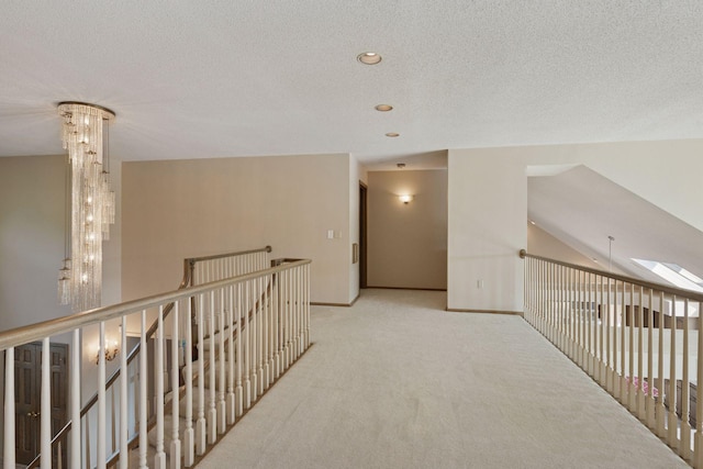 6541 Beach Rd, Eden Prairie, MN 55344 - hall with carpet floors, a textured ceiling, and an upstairs landing