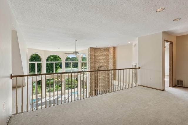 6541 Beach Rd, Eden Prairie, MN 55344 - hallway with carpet flooring, a textured ceiling, and recessed lighting