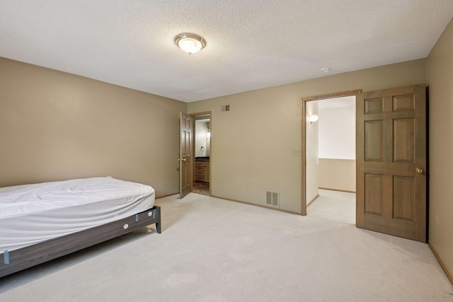 6541 Beach Rd, Eden Prairie, MN 55344 - bedroom featuring light carpet and a textured ceiling