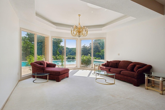 6541 Beach Rd, Eden Prairie, MN 55344 - carpeted living area with a chandelier and a raised ceiling