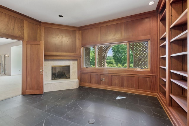 6541 Beach Rd, Eden Prairie, MN 55344 - unfurnished living room with dark marble finish flooring, a high end fireplace, and wood walls