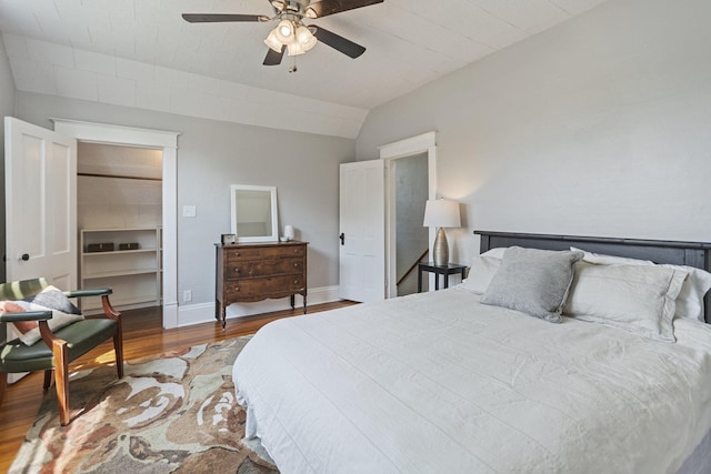 810 7th St NW, Faribault, MN 55021 - bedroom with wood finished floors, lofted ceiling, a spacious closet, and a ceiling fan