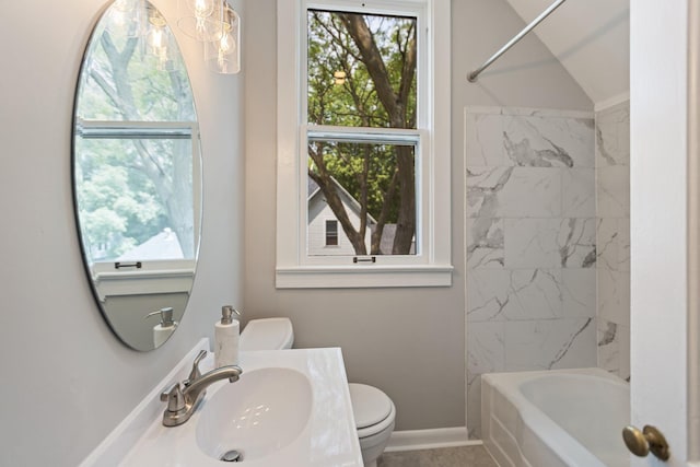 810 7th St NW, Faribault, MN 55021 - bathroom with plenty of natural light, washtub / shower combination, a chandelier, and vanity