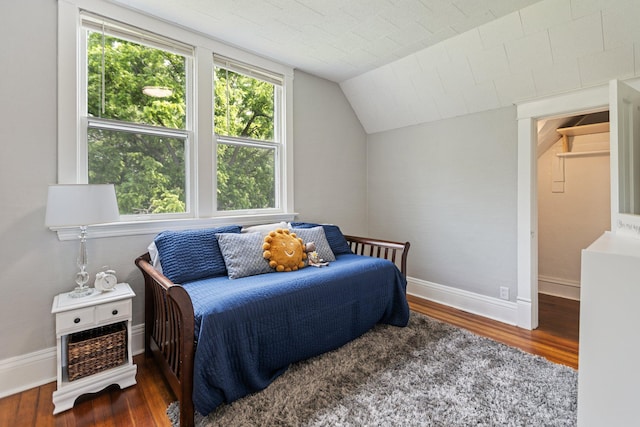 810 7th St NW, Faribault, MN 55021 - bedroom with wood finished floors and lofted ceiling