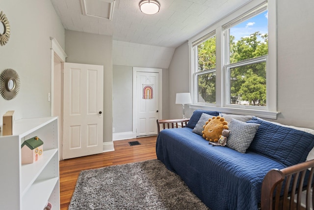810 7th St NW, Faribault, MN 55021 - bedroom with wood finished floors and vaulted ceiling