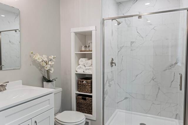 810 7th St NW, Faribault, MN 55021 - bathroom with vanity, a marble finish shower, and built in shelves