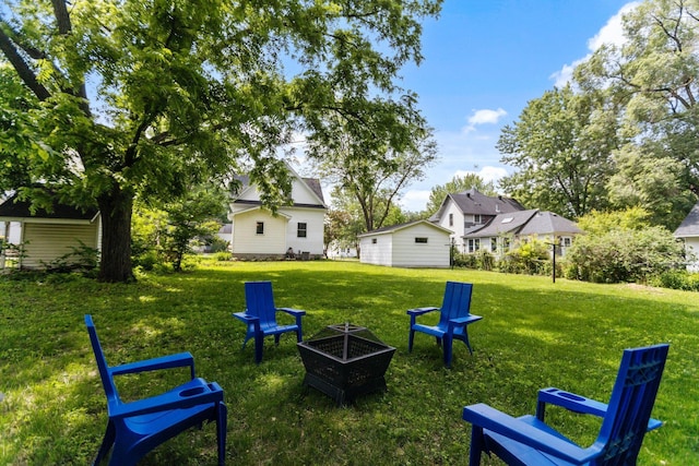 810 7th St NW, Faribault, MN 55021 - view of grassy yard with a fire pit