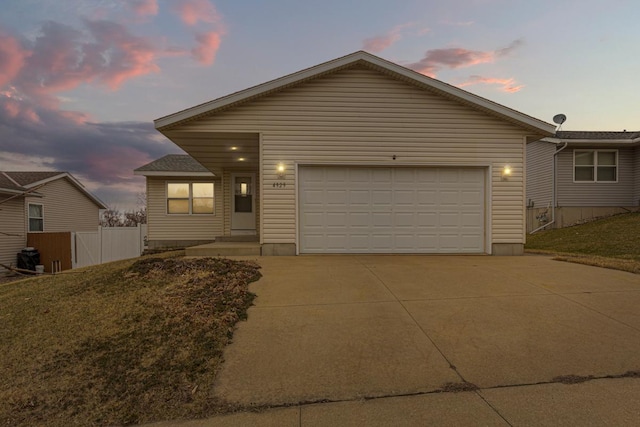 4929 Valley Dr NW, Rochester, MN 55901 - view of front of house with driveway and a garage
