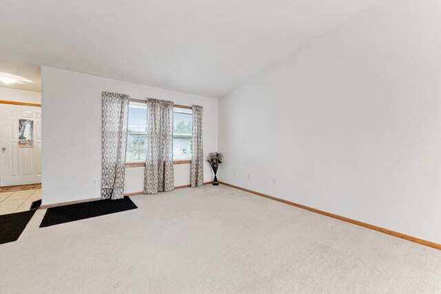 4929 Valley Dr NW, Rochester, MN 55901 - empty room featuring light carpet and baseboards