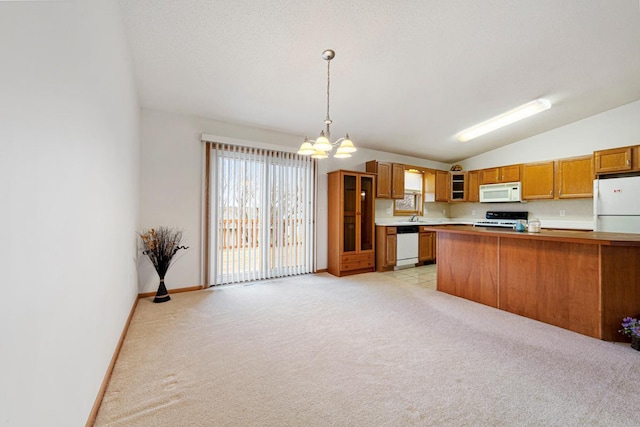 4929 Valley Dr NW, Rochester, MN 55901 - kitchen featuring white appliances, brown cabinetry, a chandelier, light countertops, and light colored carpet