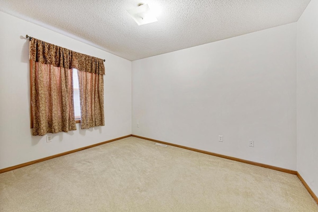 4929 Valley Dr NW, Rochester, MN 55901 - carpeted spare room with baseboards and a textured ceiling