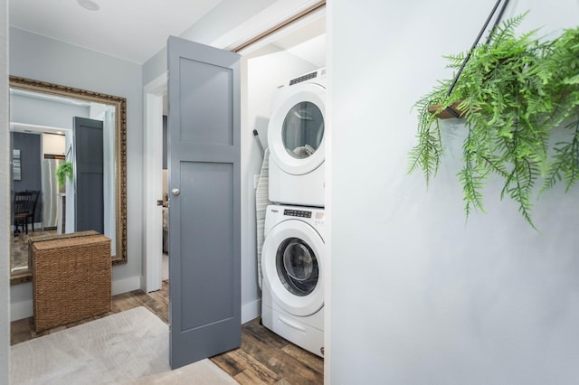 202 Park St, Alexandria, MN 56308 - laundry room featuring estacked washer and dryer and dark wood-style floors