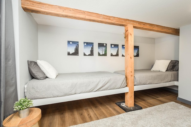 202 Park St, Alexandria, MN 56308 - bedroom featuring beamed ceiling and wood finished floors
