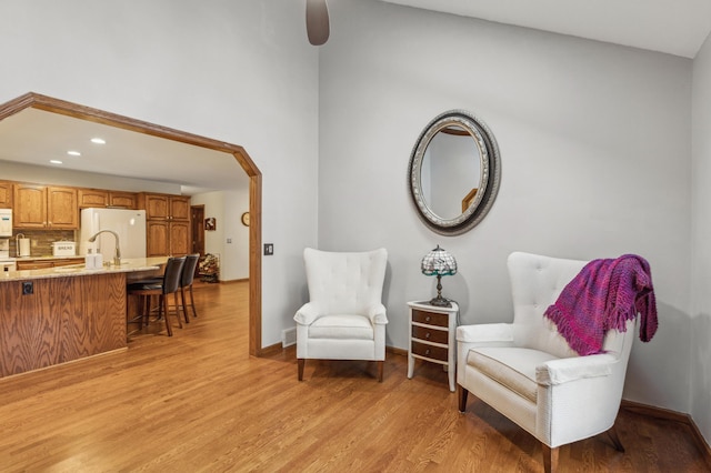 8011 County Road 13 SE, Delano, MN 55328 - sitting room featuring light wood-style flooring, ceiling fan, recessed lighting, and arched walkways