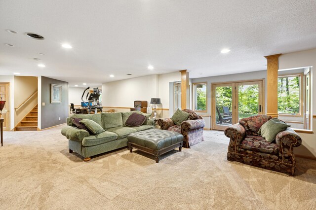8011 County Road 13 SE, Delano, MN 55328 - carpeted living room with recessed lighting, stairway, and decorative columns