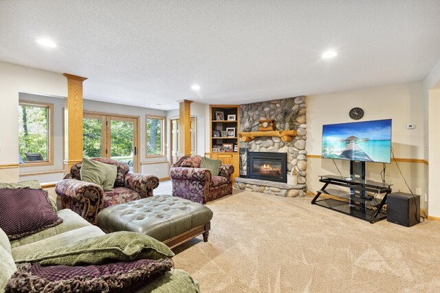8011 County Road 13 SE, Delano, MN 55328 - carpeted living room with a stone fireplace and recessed lighting