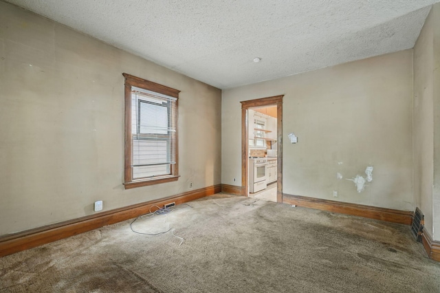 2918 15th Ave S, Minneapolis, MN 55407 - unfurnished room featuring carpet and a textured ceiling