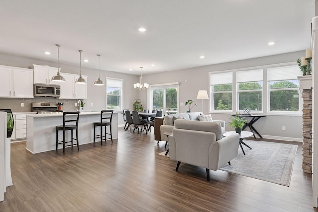 3841 Hyde Ave N, Oakdale, MN 55128 - living area with recessed lighting, a chandelier, and dark wood finished floors