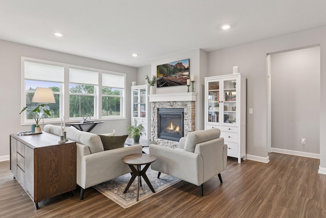3841 Hyde Ave N, Oakdale, MN 55128 - living room with a stone fireplace, dark wood finished floors, and recessed lighting