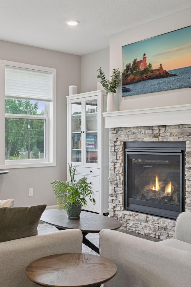 3841 Hyde Ave N, Oakdale, MN 55128 - living room featuring a stone fireplace and recessed lighting