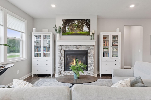 3841 Hyde Ave N, Oakdale, MN 55128 - living area with wood finished floors, recessed lighting, and a fireplace