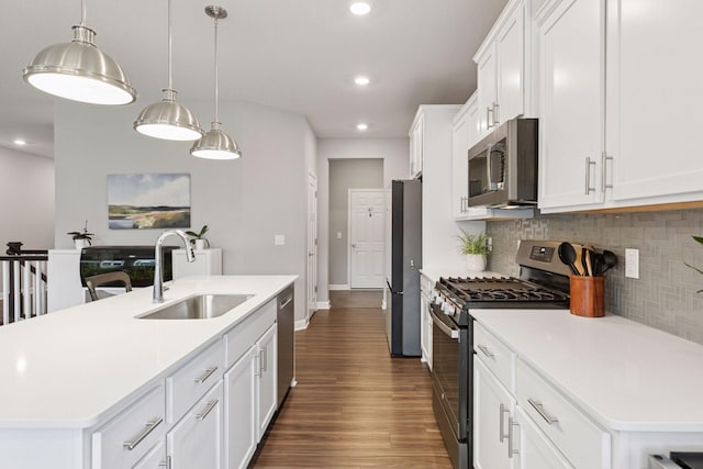 3841 Hyde Ave N, Oakdale, MN 55128 - kitchen featuring stainless steel appliances, dark wood-style floors, tasteful backsplash, recessed lighting, and light countertops