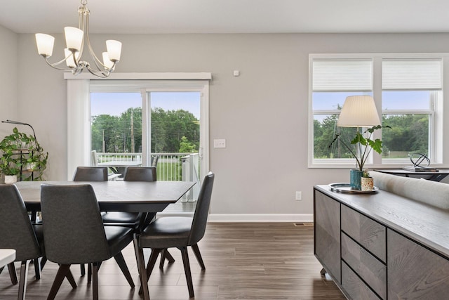 3841 Hyde Ave N, Oakdale, MN 55128 - dining room featuring a chandelier and dark wood-style floors