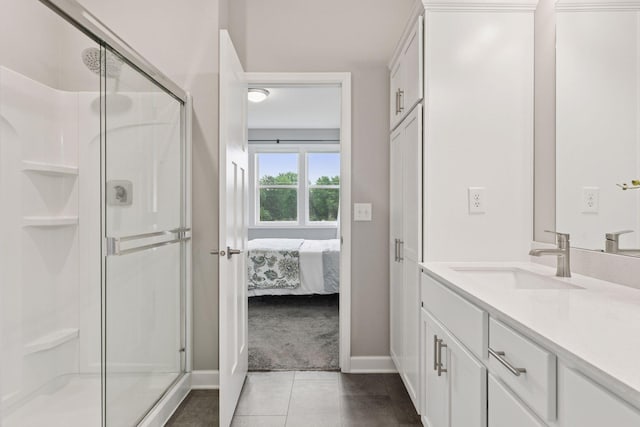 3841 Hyde Ave N, Oakdale, MN 55128 - bathroom featuring vanity, a stall shower, ensuite bathroom, and tile patterned floors