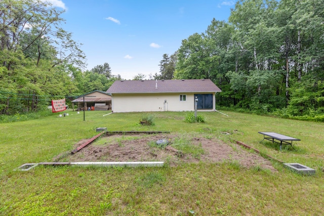 13143 County Road 116, Center Twp, MN 56465 - rear view of property featuring a yard