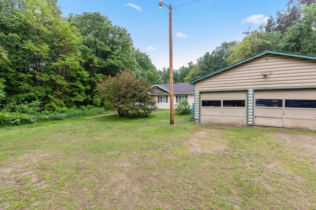 13143 County Road 116, Center Twp, MN 56465 - view of green lawn with a detached garage and an outdoor structure