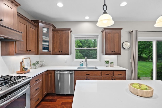 13332 Coachford Ave, Rosemount, MN 55068 - kitchen featuring stainless steel appliances, dark wood-type flooring, decorative light fixtures, glass insert cabinets, and light countertops