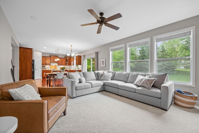 13332 Coachford Ave, Rosemount, MN 55068 - living room with a chandelier, a ceiling fan, light carpet, and recessed lighting