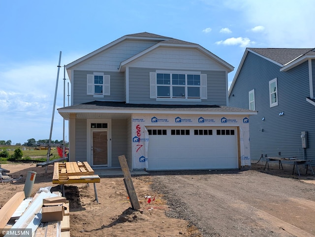 6817 104th St S, Cottage Grove, MN 55016 - view of front facade with driveway and an attached garage