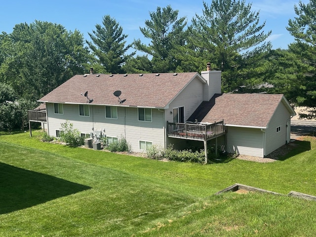 7315 Bagpipe Blvd, Eden Prairie, MN 55346 - back of house with a deck, a chimney, a lawn, and a shingled roof
