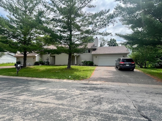 7315 Bagpipe Blvd, Eden Prairie, MN 55346 - split level home featuring driveway, a garage, a front lawn, and a chimney