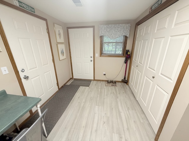 2228 Douglynn Ln, Saint Paul, MN 55119 - foyer with light wood finished floors and baseboards