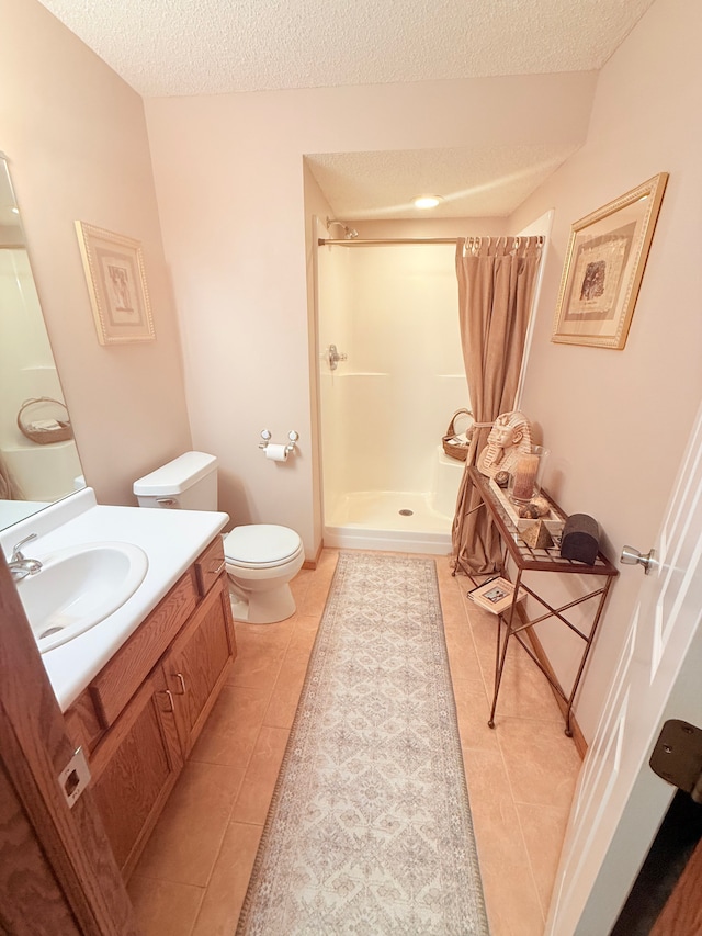 2228 Douglynn Ln, Saint Paul, MN 55119 - full bathroom with a stall shower, vanity, a textured ceiling, and tile patterned flooring