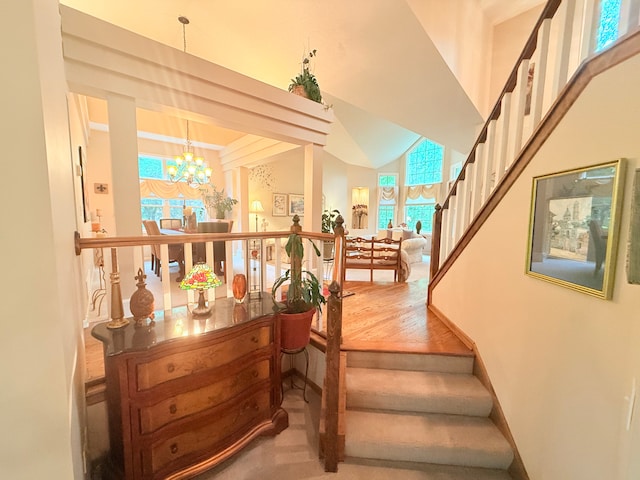2228 Douglynn Ln, Saint Paul, MN 55119 - stairs featuring a chandelier, high vaulted ceiling, and carpet flooring