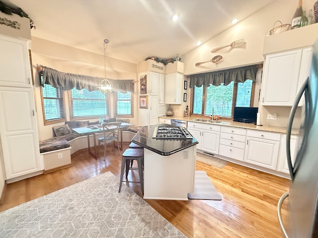 2228 Douglynn Ln, Saint Paul, MN 55119 - kitchen with appliances with stainless steel finishes, healthy amount of natural light, white cabinetry, light wood-type flooring, and recessed lighting