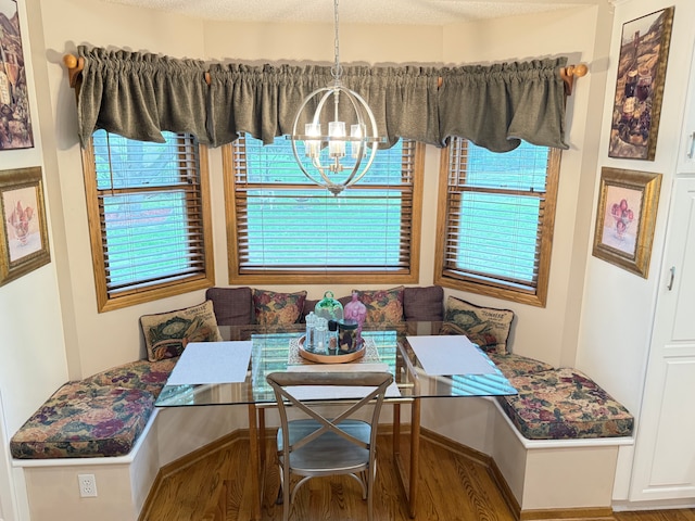 2228 Douglynn Ln, Saint Paul, MN 55119 - dining area with breakfast area, a chandelier, wood finished floors, and healthy amount of natural light