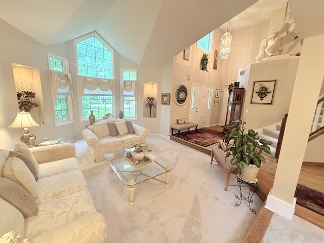 2228 Douglynn Ln, Saint Paul, MN 55119 - carpeted living area featuring high vaulted ceiling, healthy amount of natural light, and stairs