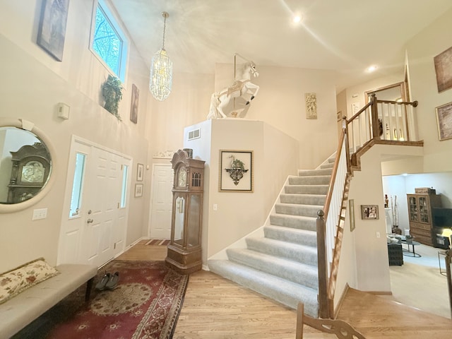 2228 Douglynn Ln, Saint Paul, MN 55119 - entrance foyer with a high ceiling, stairway, and wood finished floors