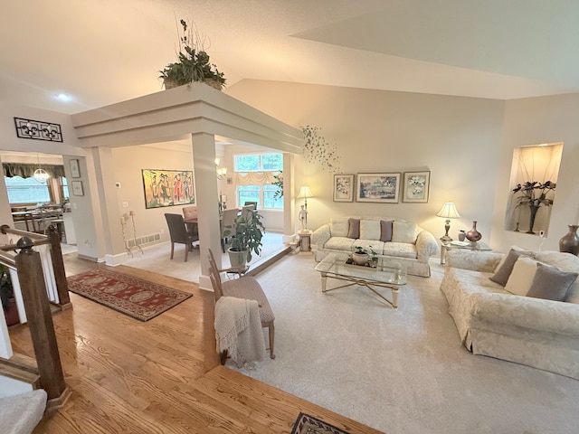 2228 Douglynn Ln, Saint Paul, MN 55119 - living room with wood finished floors, vaulted ceiling, and decorative columns