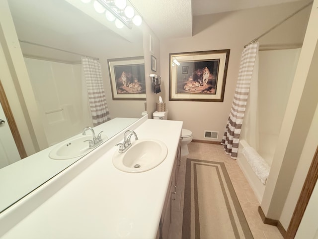 2228 Douglynn Ln, Saint Paul, MN 55119 - bathroom featuring vanity, shower / tub combo with curtain, tile patterned flooring, and a textured ceiling