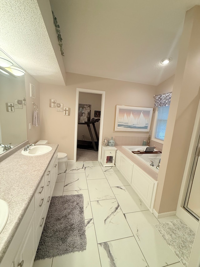 2228 Douglynn Ln, Saint Paul, MN 55119 - bathroom featuring a bath, double vanity, and marble look tiles