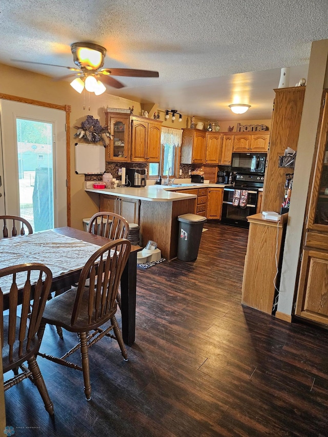 147 5th St, Felton, MN 56536 - dining room with a textured ceiling, plenty of natural light, dark wood-style flooring, and a ceiling fan